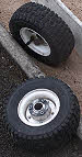 Side Wheels for driving over hard areas or for raising the cutting height